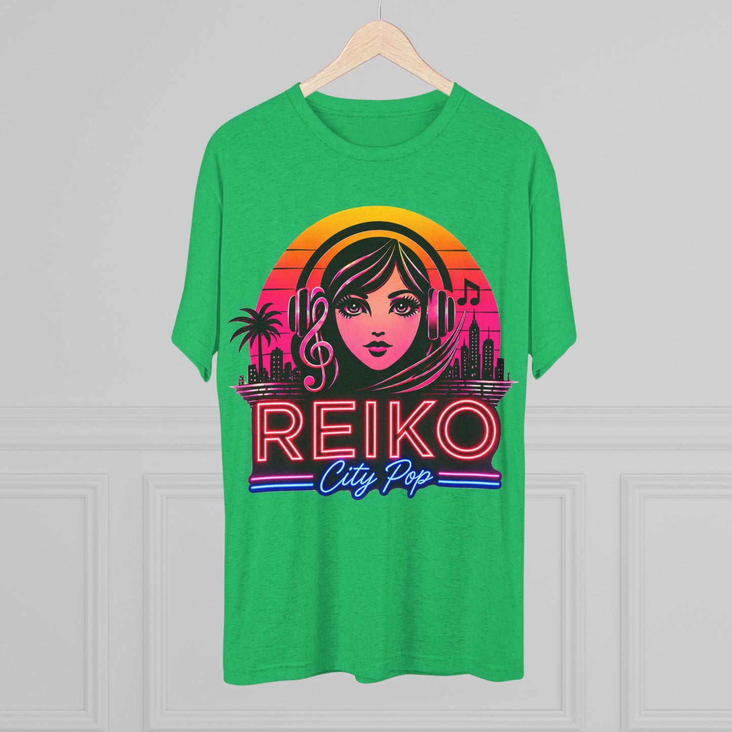 Front view of the Reiko Takahashi City Pop Sunset Logo Tee in Envy Green, printed on a premium Next Level tri-blend T-shirt and displayed on a wooden hanger. Features retro neon artwork inspired by the song "Sunset Road."