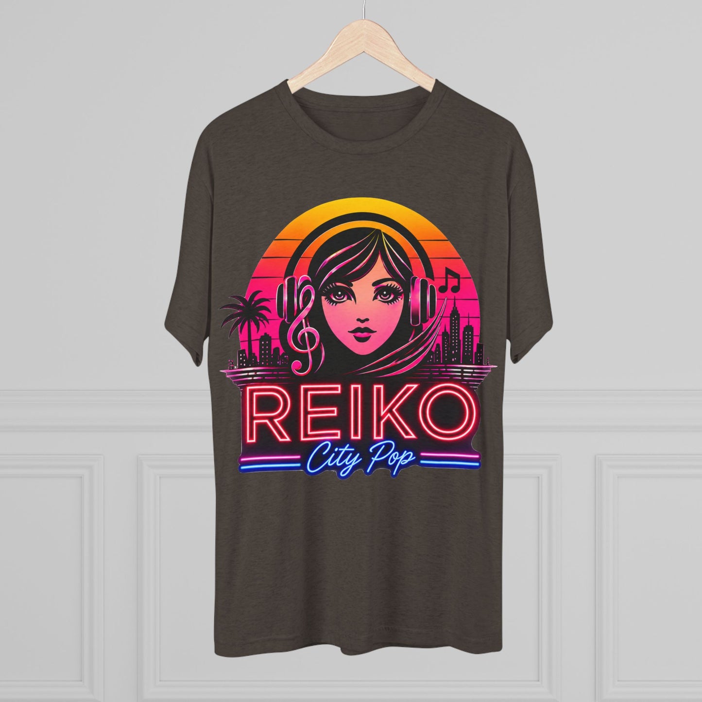 Front view of the Reiko Takahashi City Pop Sunset Logo Tee in Macchiato, printed on a premium Next Level tri-blend T-shirt and displayed on a wooden hanger. Features retro neon artwork inspired by the song "Sunset Road."