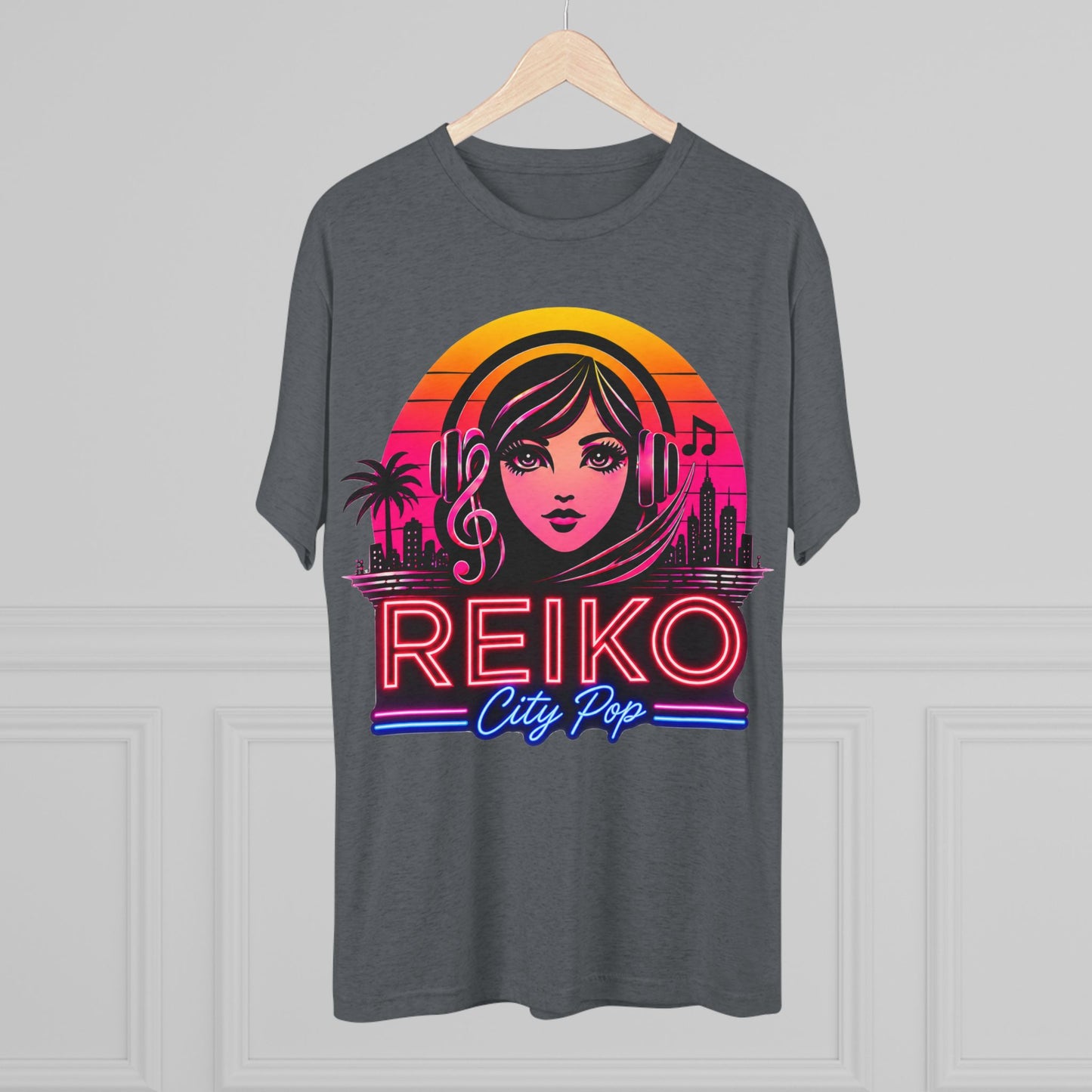 Front view of the Reiko Takahashi City Pop Sunset Logo Tee on Premium Heather, printed on a Next Level tri-blend T-shirt and displayed on a wooden hanger. Features retro neon artwork inspired by the song "Sunset Road."